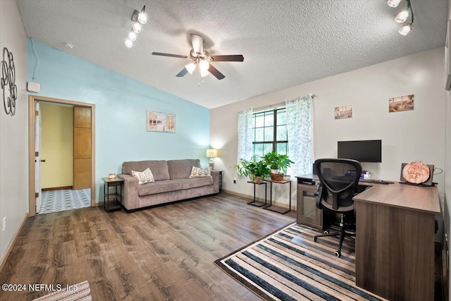 office space featuring wood-type flooring, lofted ceiling, ceiling fan, and a textured ceiling