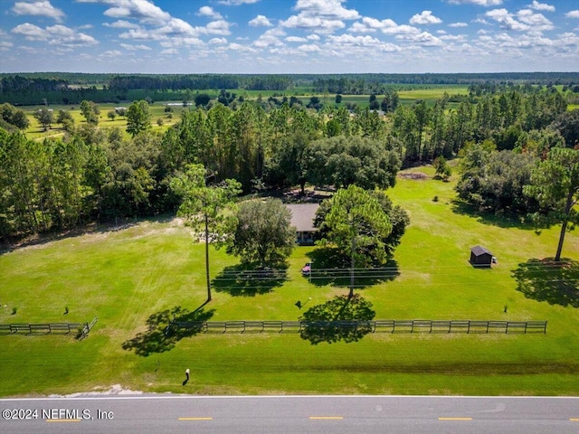 birds eye view of property with a rural view