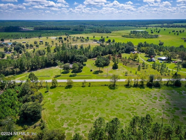 birds eye view of property featuring a rural view