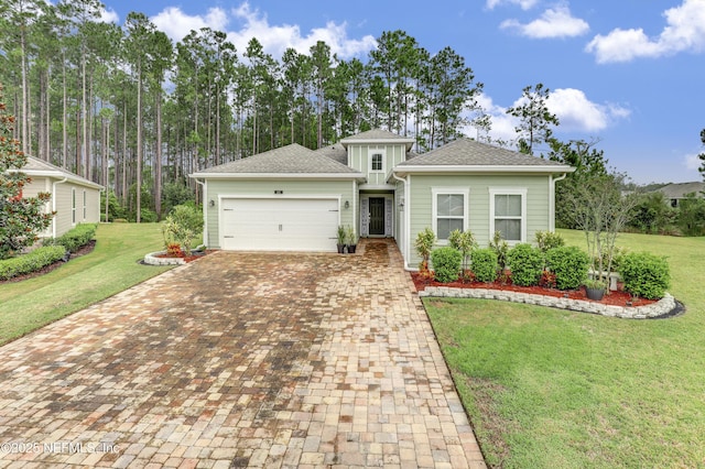 view of front facade with a garage and a front yard