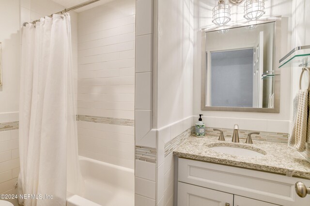 bathroom with vanity and shower / bath combo with shower curtain