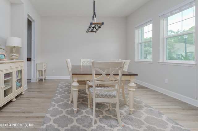 dining space with light wood-type flooring