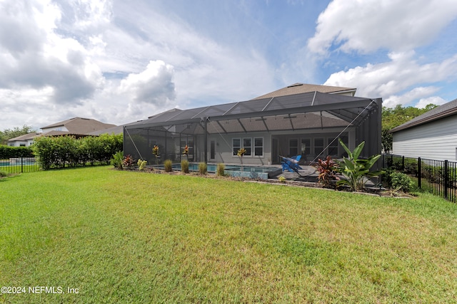 view of yard featuring a patio and a lanai