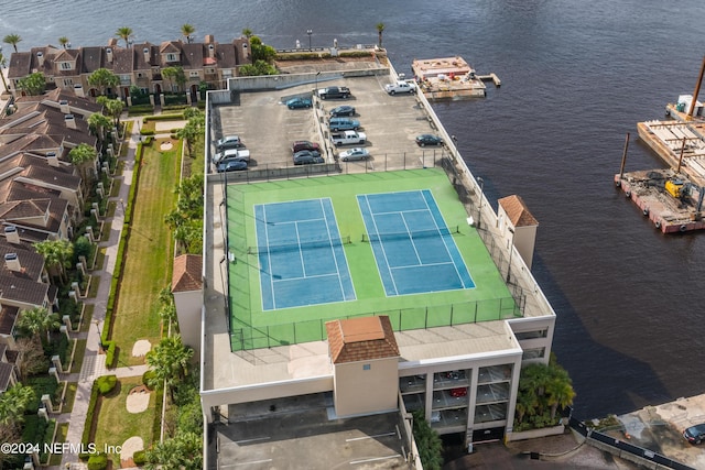 bird's eye view with a water view and a residential view