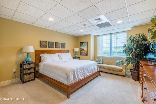 carpeted bedroom with baseboards, visible vents, a paneled ceiling, and recessed lighting