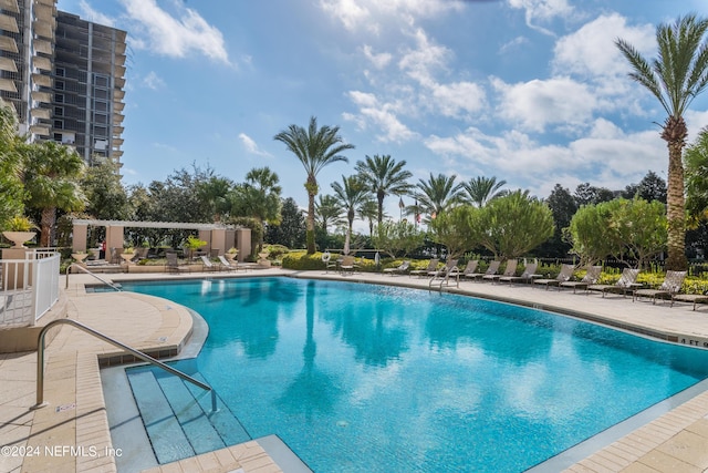 community pool featuring a patio area