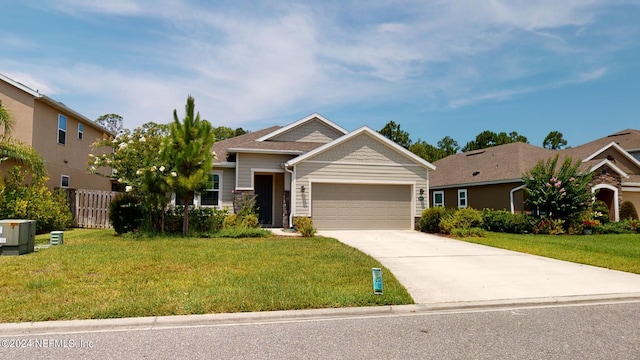 view of front of house featuring a front lawn and a garage