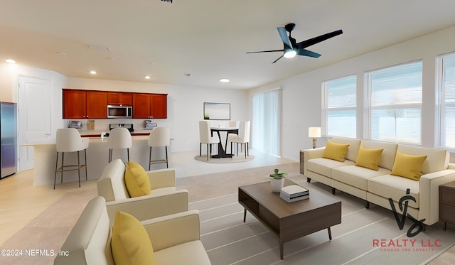 living room with ceiling fan