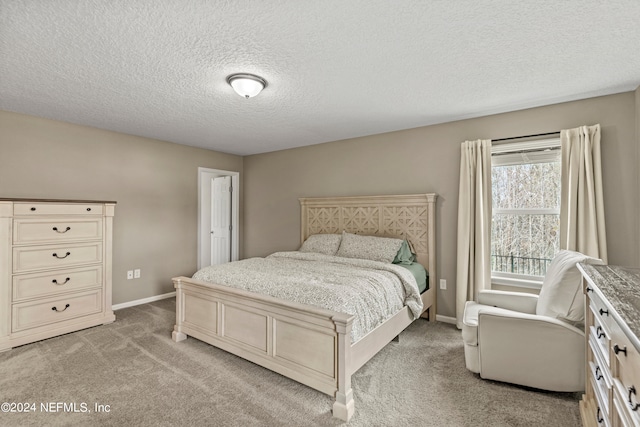 carpeted bedroom with a textured ceiling