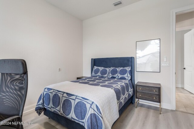 bedroom featuring light wood-type flooring