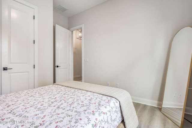 bedroom featuring hardwood / wood-style flooring