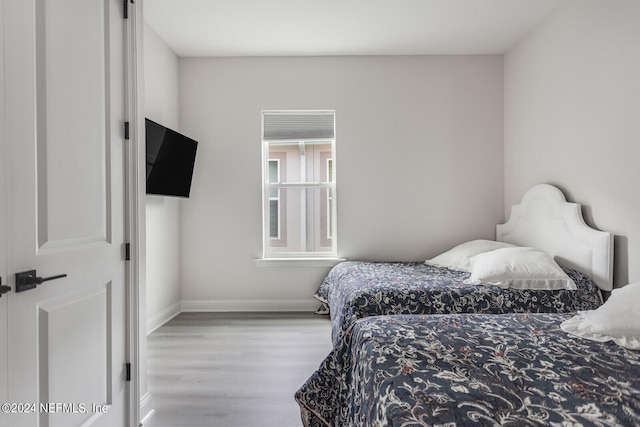 bedroom with light hardwood / wood-style floors