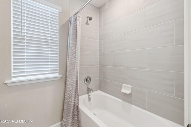 bathroom featuring shower / bathtub combination with curtain