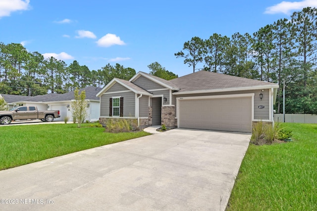 view of front of property with a front lawn and a garage