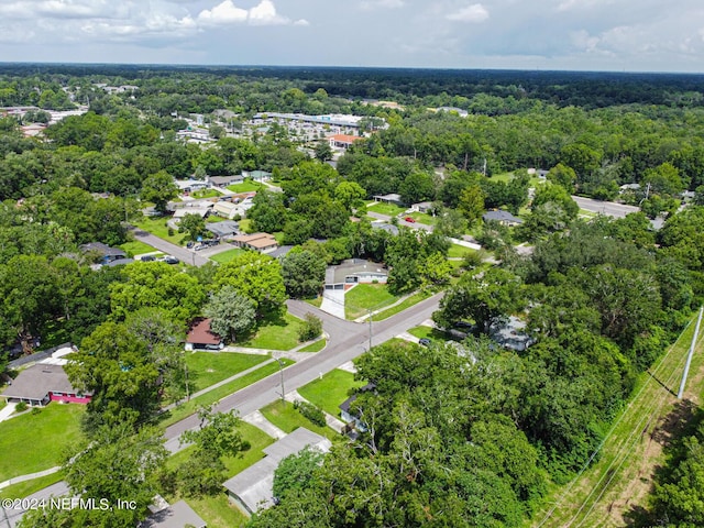 birds eye view of property featuring a view of trees and a residential view