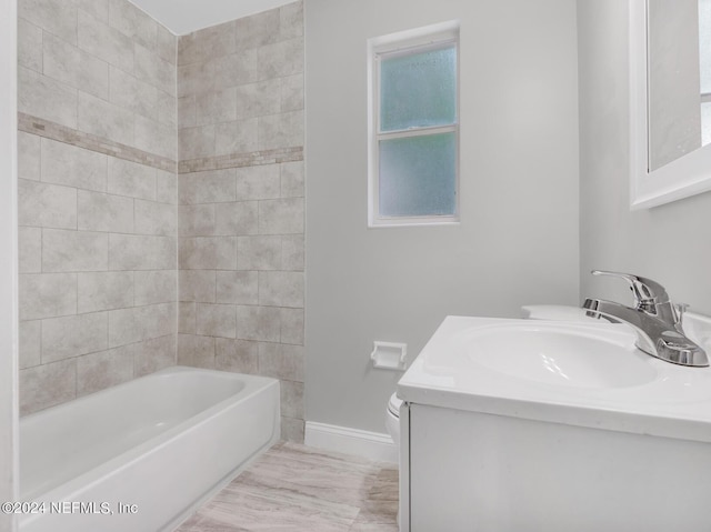 full bathroom featuring vanity, toilet, and baseboards