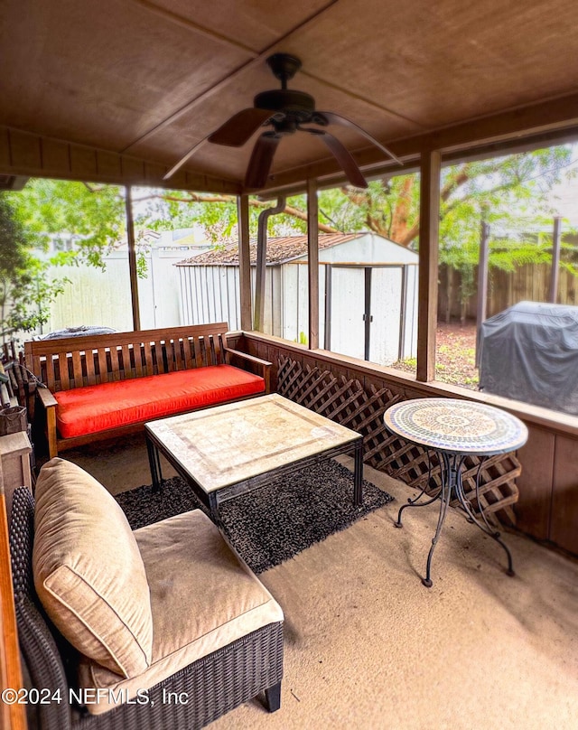 sunroom featuring ceiling fan