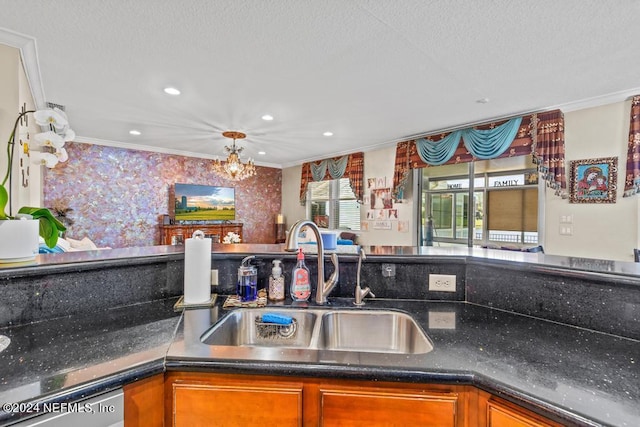 kitchen featuring a notable chandelier, ornamental molding, and sink