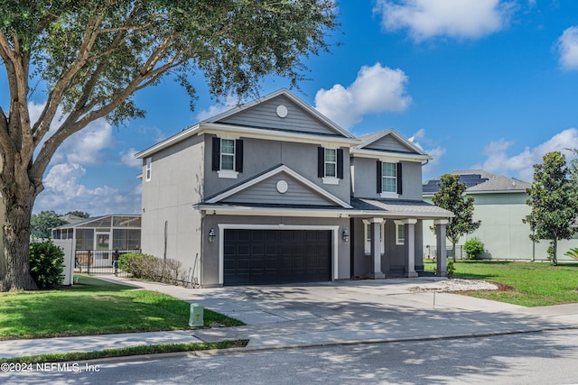 front facade with a garage and a front yard