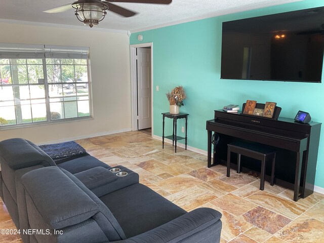 living room featuring ornamental molding and ceiling fan