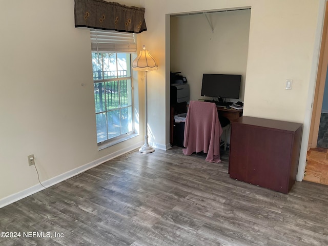 home office with hardwood / wood-style floors