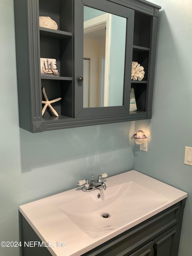 bathroom with vanity and built in features