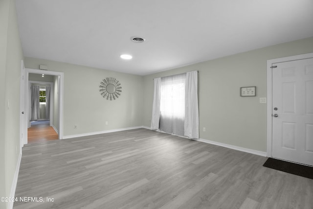 spare room with light hardwood / wood-style flooring