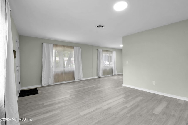 unfurnished living room featuring light wood-type flooring