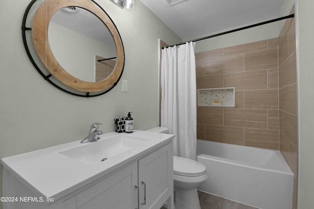 full bathroom featuring wood-type flooring, toilet, shower / tub combo, and vanity