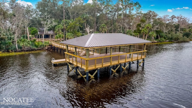 view of dock featuring a gazebo and a water view