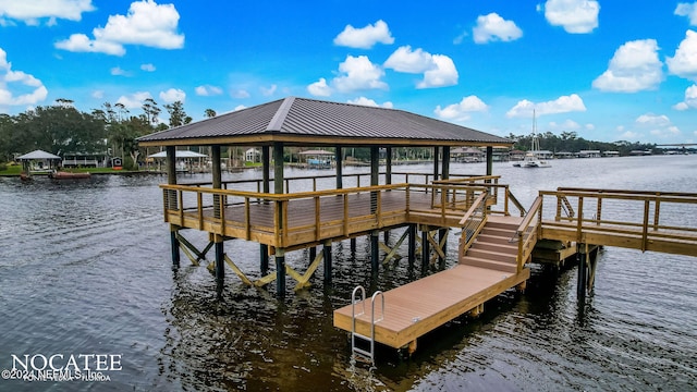 dock area with a gazebo and a water view