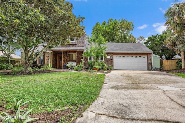 view of front of house featuring a front yard and a garage