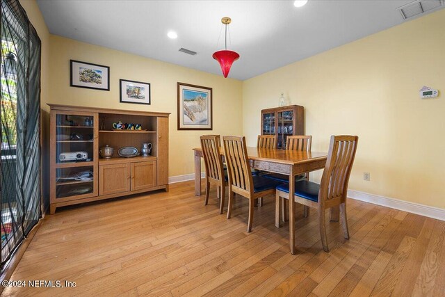 dining space featuring light hardwood / wood-style flooring