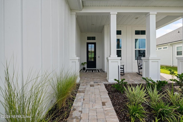 doorway to property featuring a porch