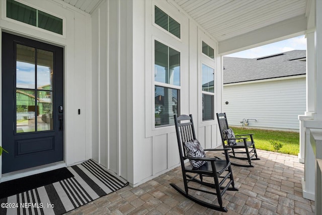 doorway to property with a porch