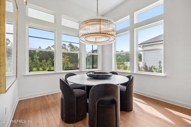 dining area featuring a chandelier and light hardwood / wood-style floors