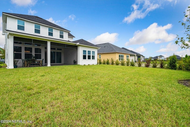 back of house featuring a patio area and a yard