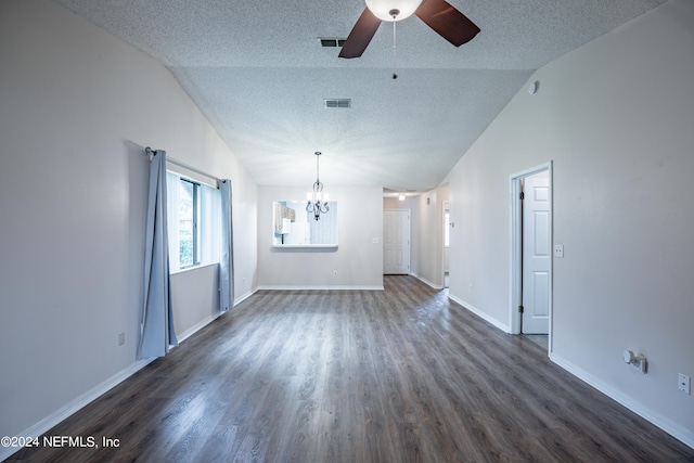 unfurnished living room with vaulted ceiling, ceiling fan with notable chandelier, and dark hardwood / wood-style flooring