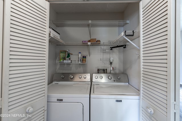 laundry room with washer and dryer