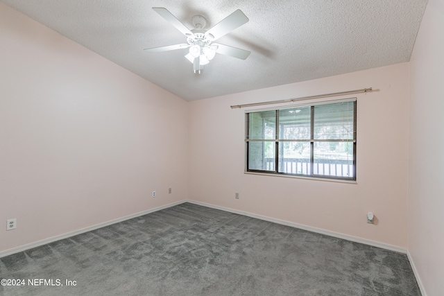 empty room with a textured ceiling, ceiling fan, and carpet floors