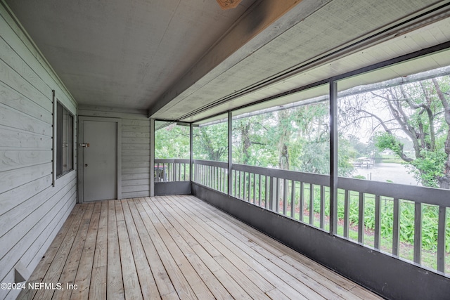 unfurnished sunroom featuring plenty of natural light