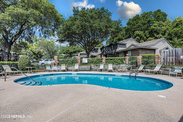 view of pool featuring a patio area