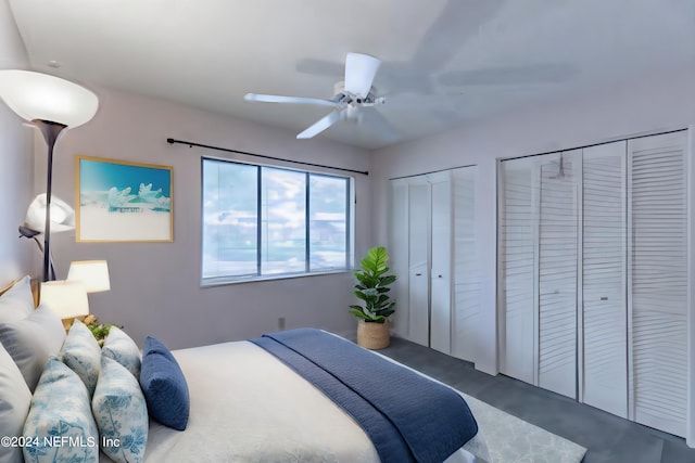 bedroom featuring two closets and ceiling fan