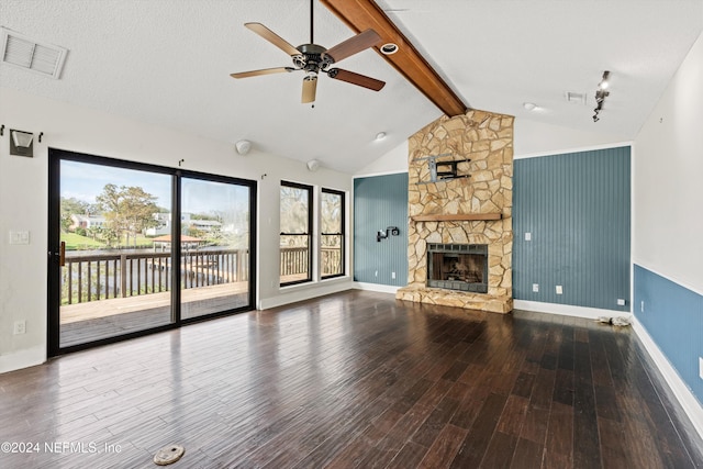 unfurnished living room with ceiling fan, vaulted ceiling with beams, wood-type flooring, a textured ceiling, and a fireplace