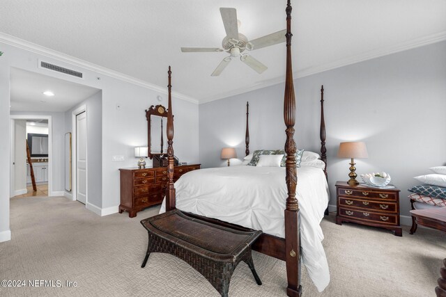 bedroom with ceiling fan, crown molding, and light carpet