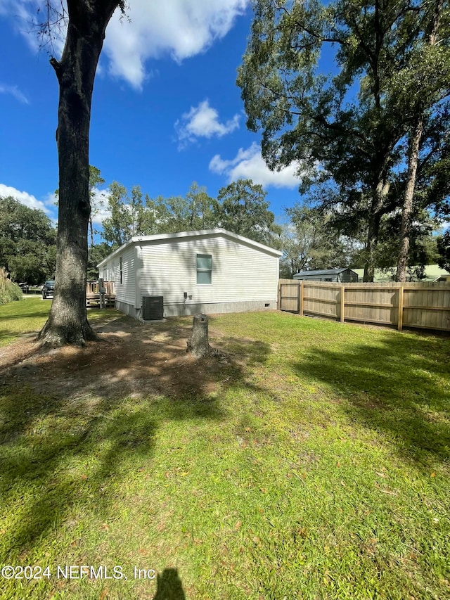 view of yard featuring central AC