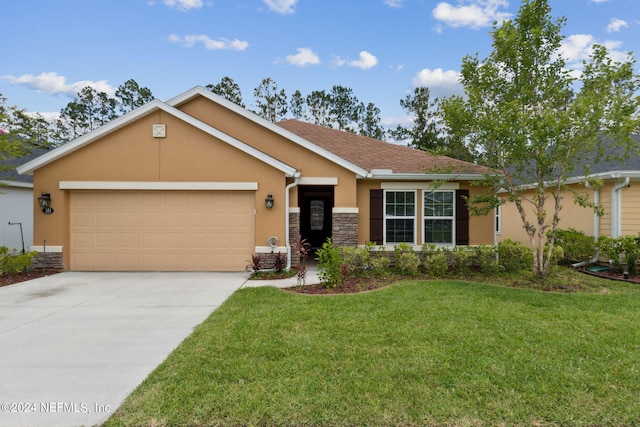 single story home featuring a garage and a front yard