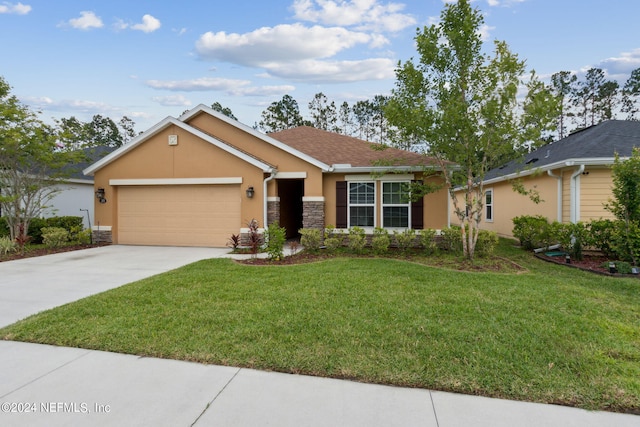 single story home with a garage and a front yard