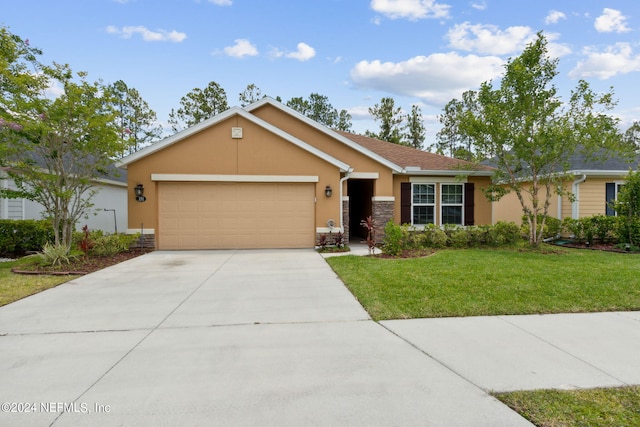 single story home featuring a front yard and a garage