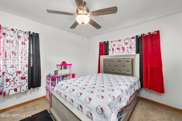 bedroom with ceiling fan and light carpet